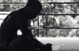 Man stretching in black and white